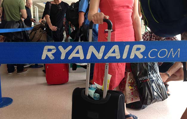 Ryanair passengers queue for their flight at Jerez Airport in Spain